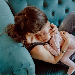 Mom practices skin-to-skin contact with her 11-month-old baby. 